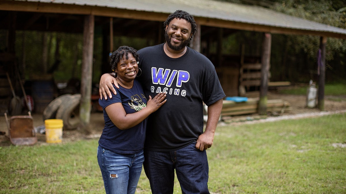 Jordan Davis and Ameal Woods stand outside in Mississippi